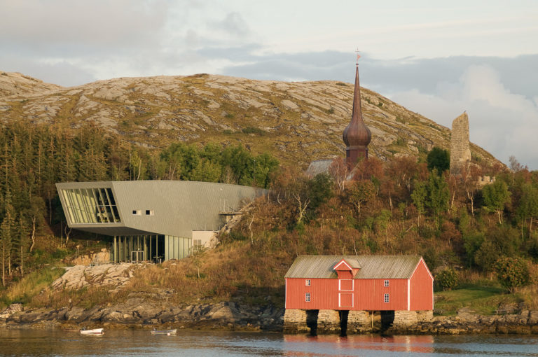 The Petter Dass centre, the onion-shaped steeple and the Petter Dass memorial. Photo: Erlend Haarberg / Visit Helgeland