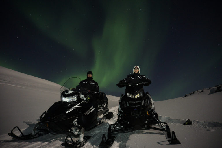 The landscape on Magerøya Island is made for snowmobiling, with low, rolling hills and valleys. However, the Northern Lights bring the tour to a full stop ©www.71-nord.no