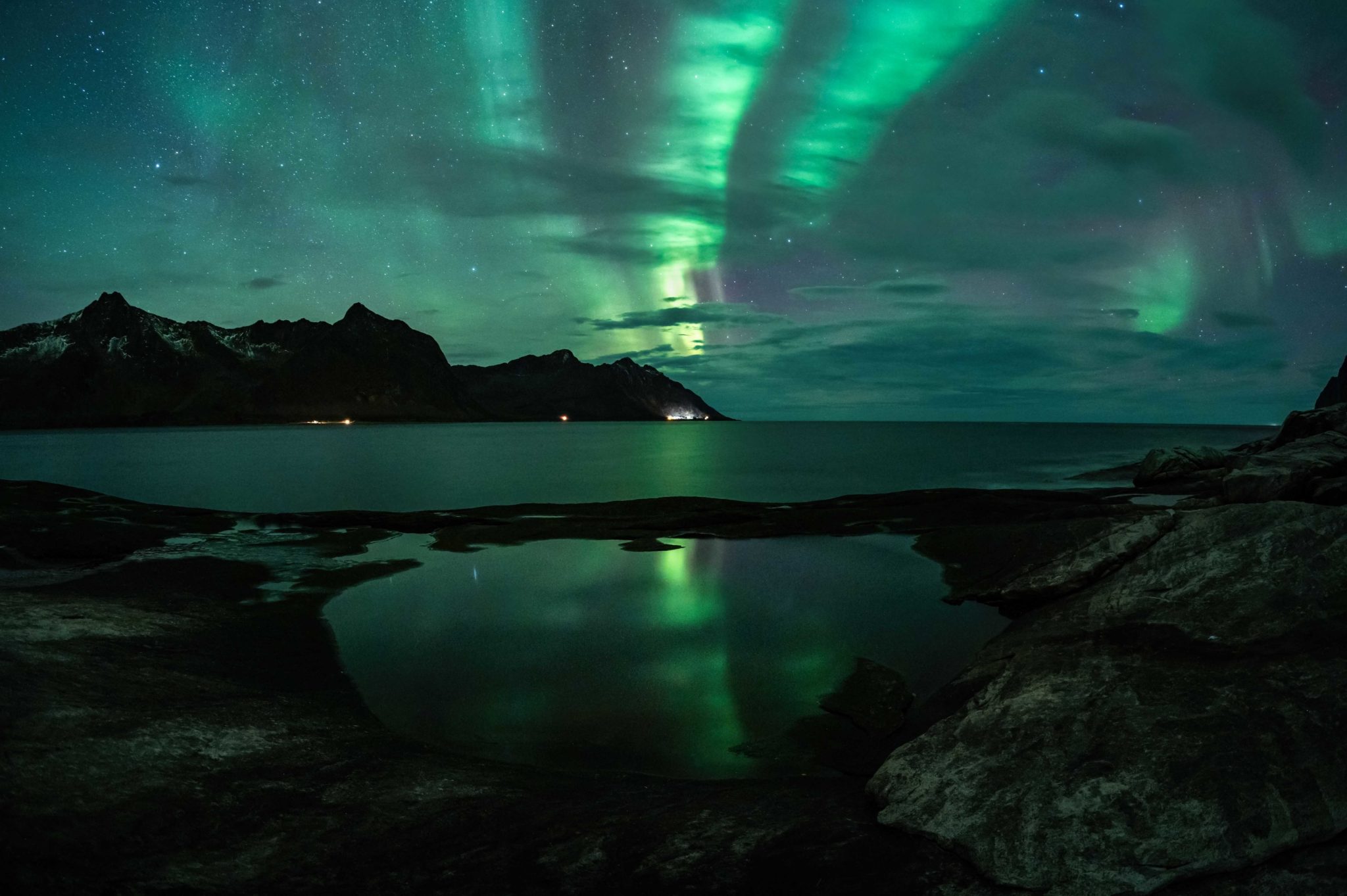 Aurora fighting with the clouds © Kristoffer Vangen