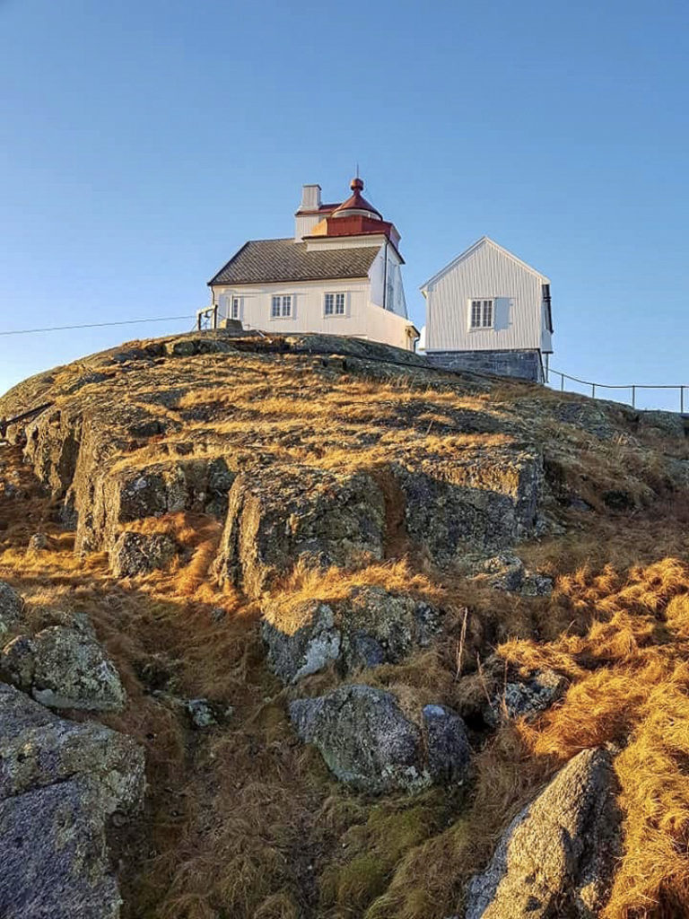 The grass is brown in winter at Myken lighthouse, found on its own islet at the fishing village of Myken © Myken fyr